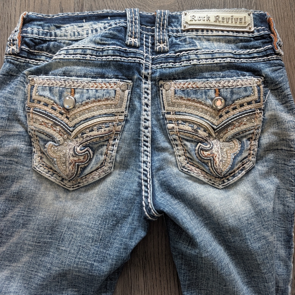 Rock Revival Distressed Blue Jeans with Embellished Pockets